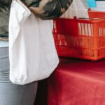 Viral Marketing - Unrecognizable woman in protective gloves buying goods on market