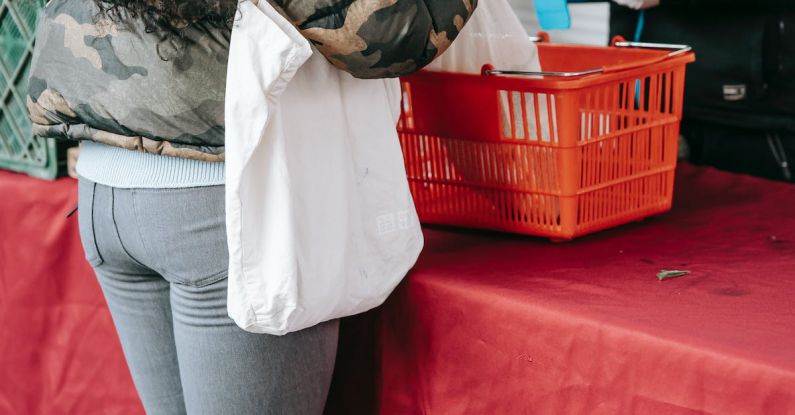 Viral Marketing - Unrecognizable woman in protective gloves buying goods on market