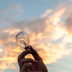 Innovation - Person Holding Clear Light Bulb