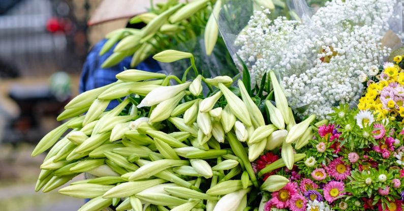 Consultative Selling - A woman is selling flowers on a cart