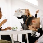 Workplace Conflict - A Woman Standing in Front of the Group