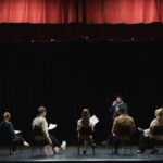 Performance Review - Group of People Sitting on Chair on Stage