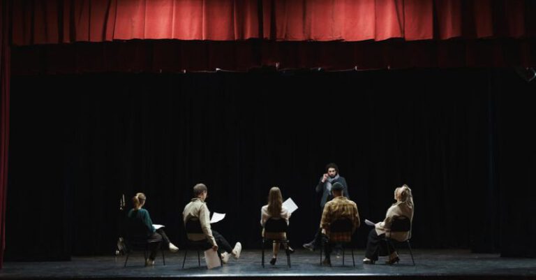 Performance Review - Group of People Sitting on Chair on Stage