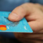 Business Debt - Person Holding Debit Card