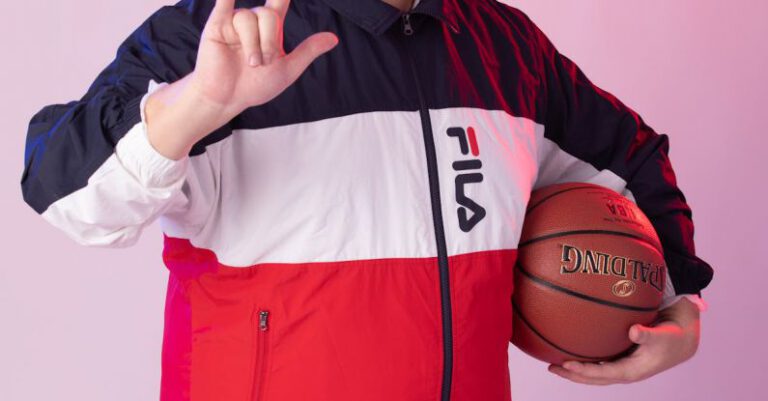 Campaign Success - A man in a jacket holding a basketball ball