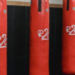 Supply Chain Disruptions - Interior of boxing gym with heavy punching bags hanging on chains for workout