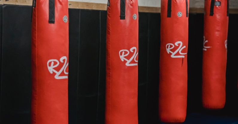 Supply Chain Disruptions - Interior of boxing gym with heavy punching bags hanging on chains for workout