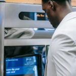 Financial Automation - Man using an Automated Teller Machine
