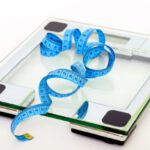 Scale - Blue Tape Measuring on Clear Glass Square Weighing Scale